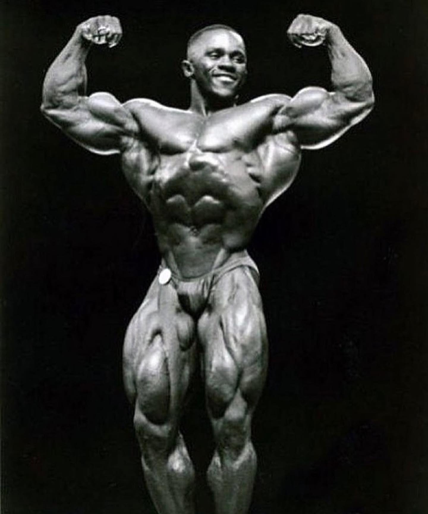 John Sherman on stage — front double biceps, competition archive